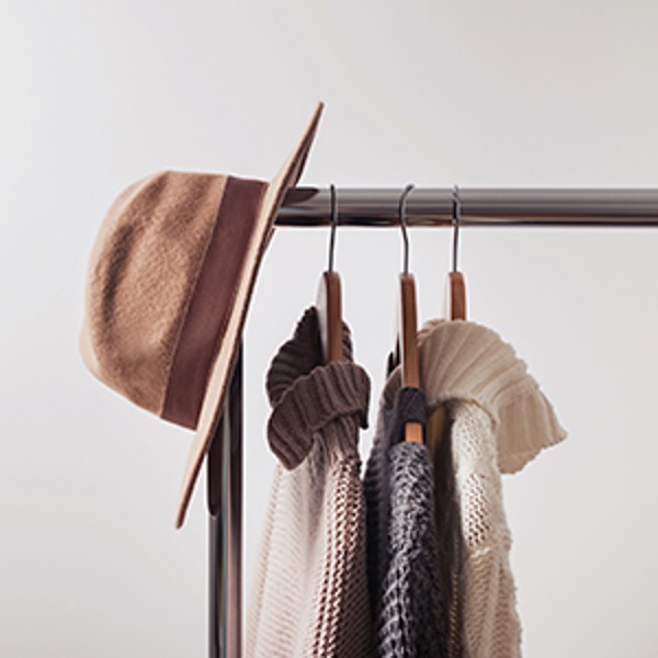 Clothes and hat on rack